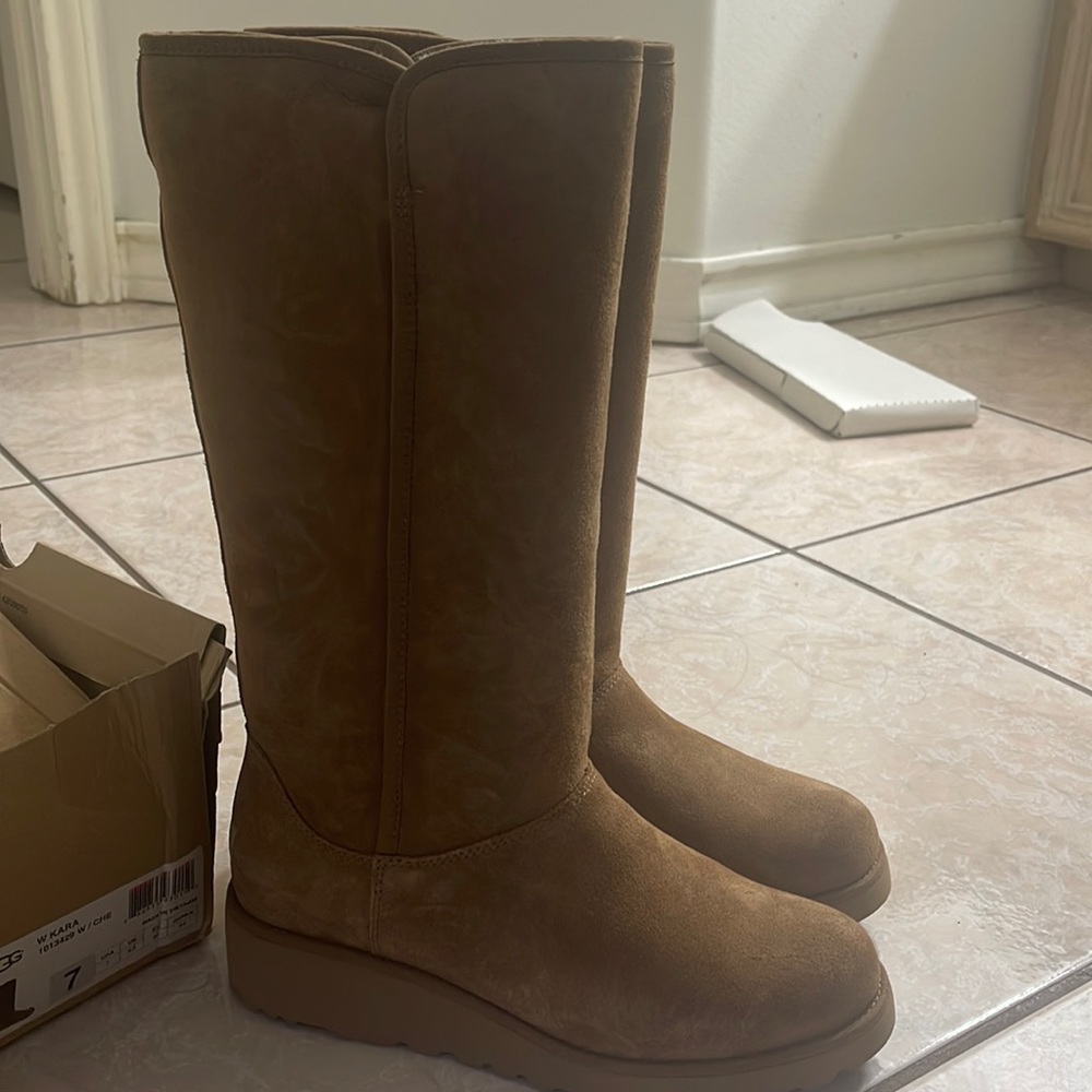 New worn UGG high boots
